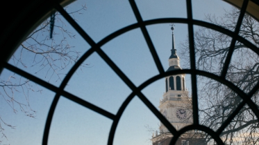 Baker Tower is seen through a window.